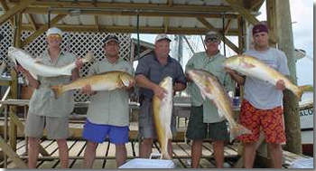 Capt. John Frankson's Happy Client's  with 5  large Redfish !!